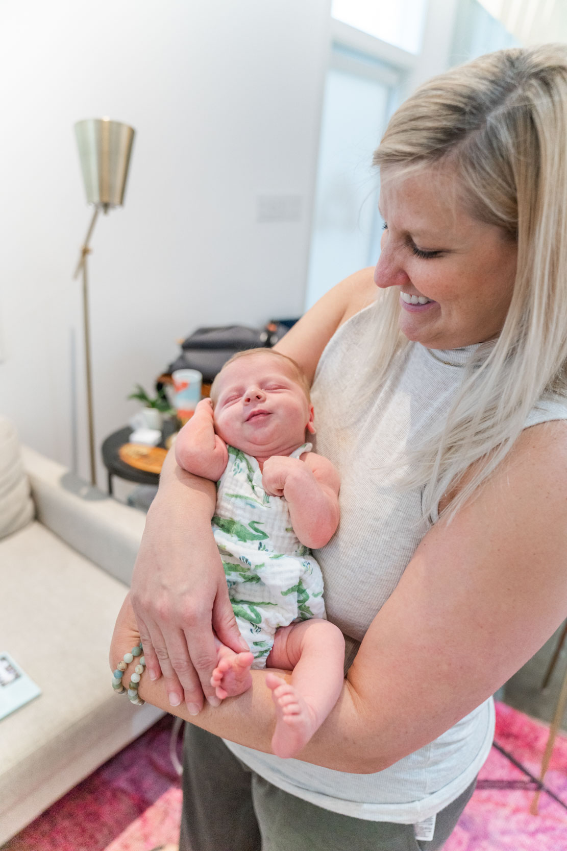 Mother holding baby while baby sleeps