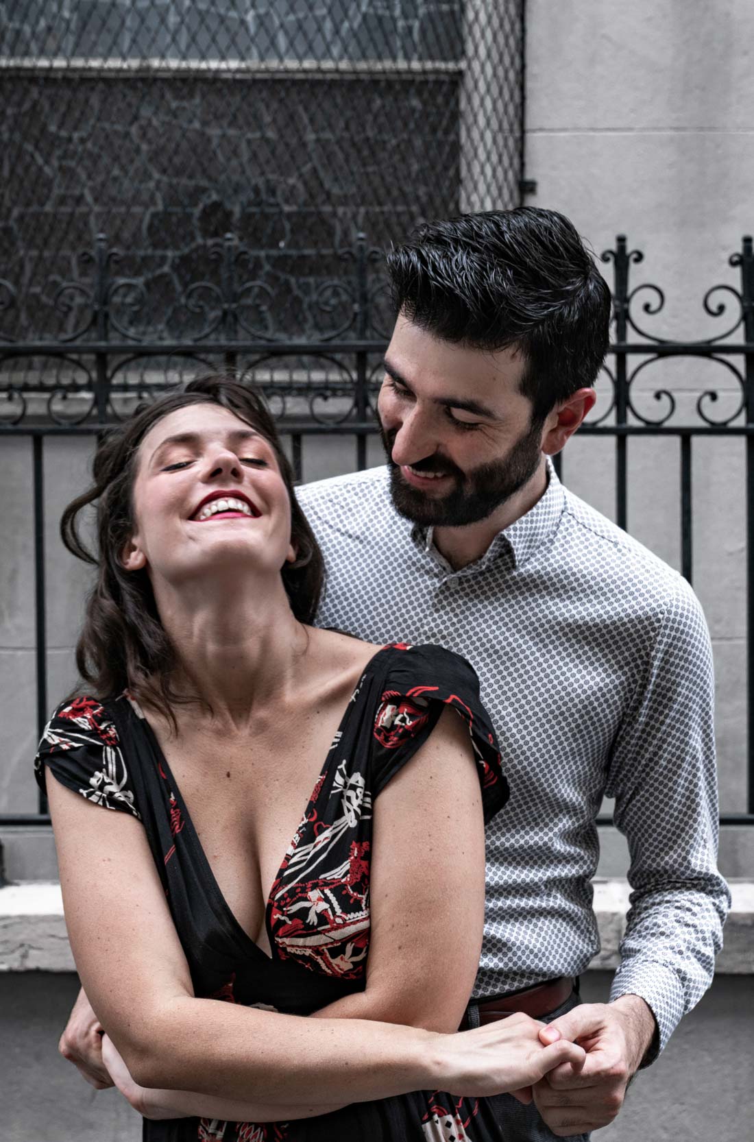 Romantic couple laughing and hugging in the New Orleans French Quarter