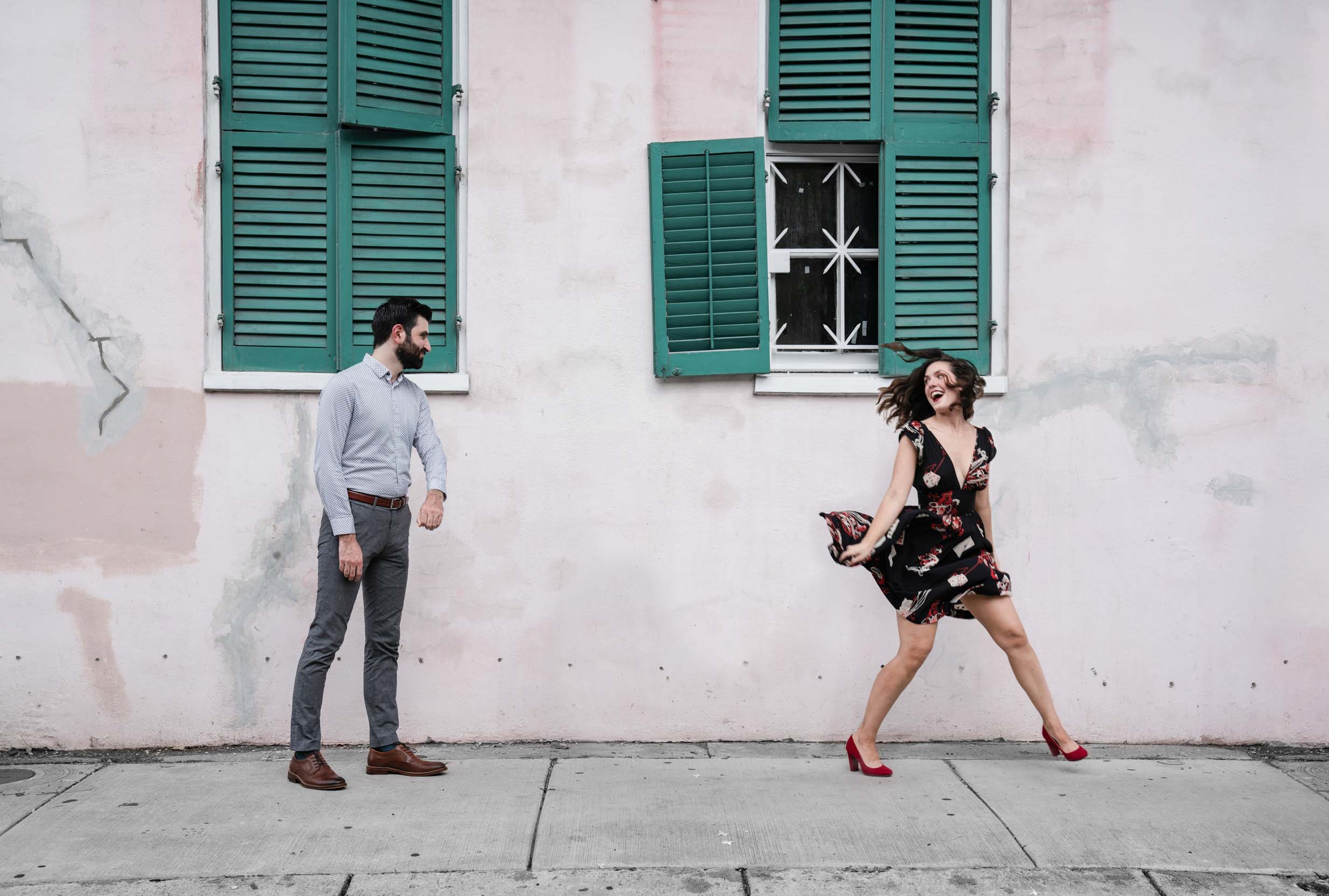 Romantic couple laughing and dancing together in the New Orleans French Quarter