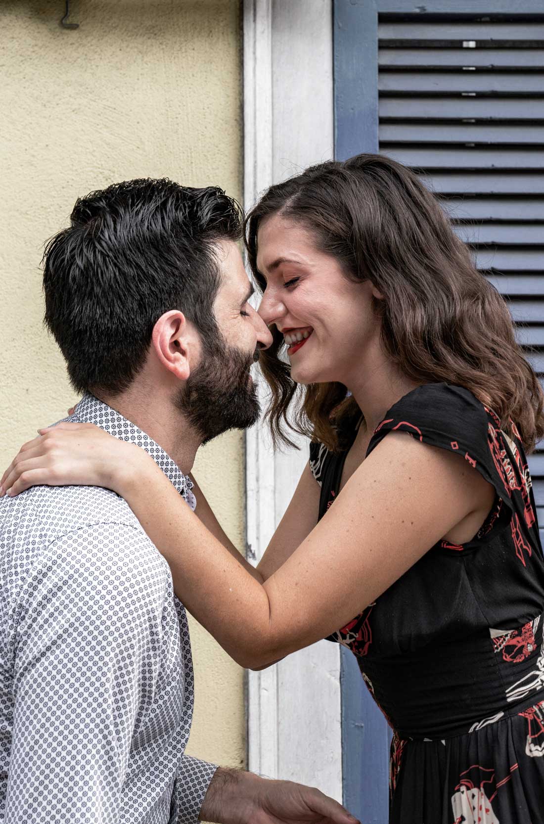 Romantic couple smiling and kissing in the New Orleans French Quarter