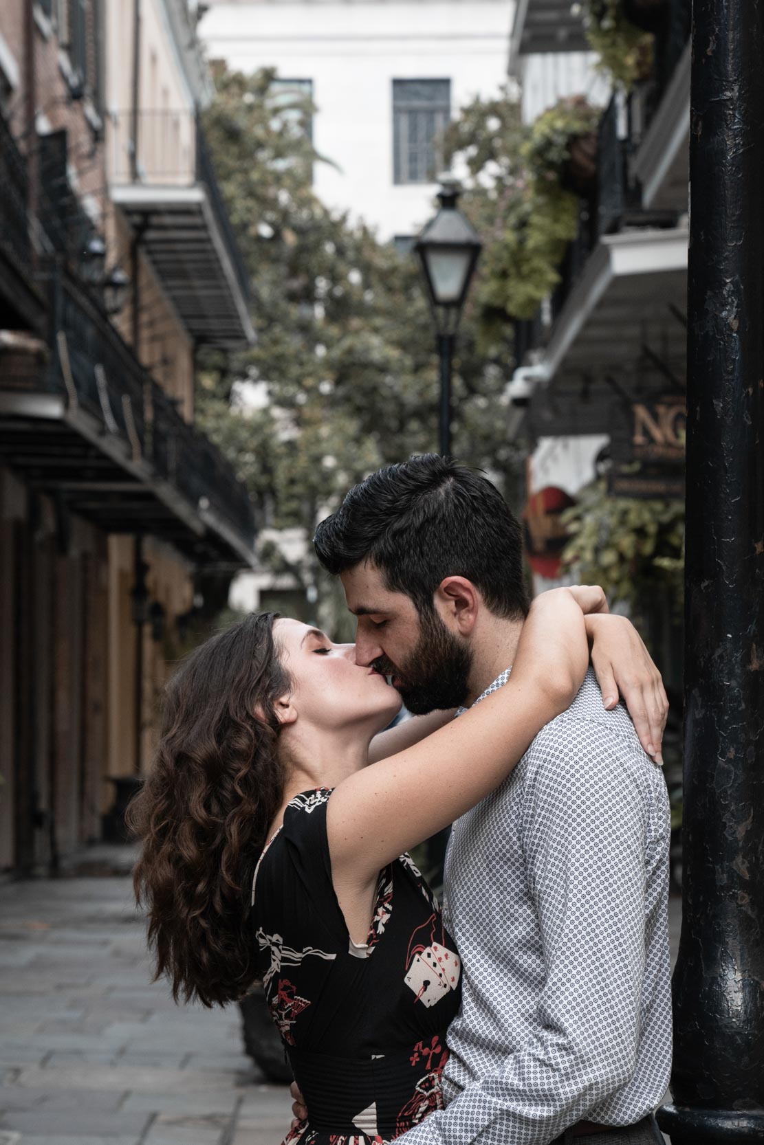 Romantic couple kissing and falling in love in a New Orleans French Quarter alley
