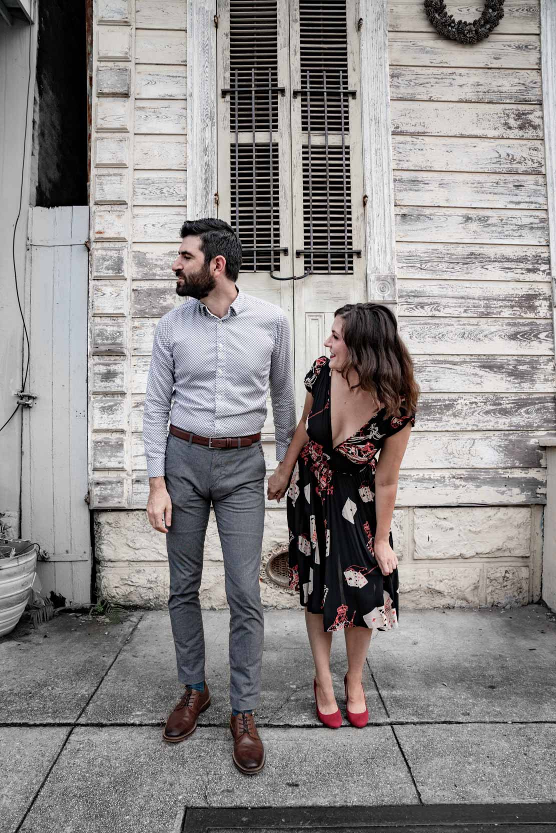 Romantic couple posing and holding hands in the New Orleans French Quarter