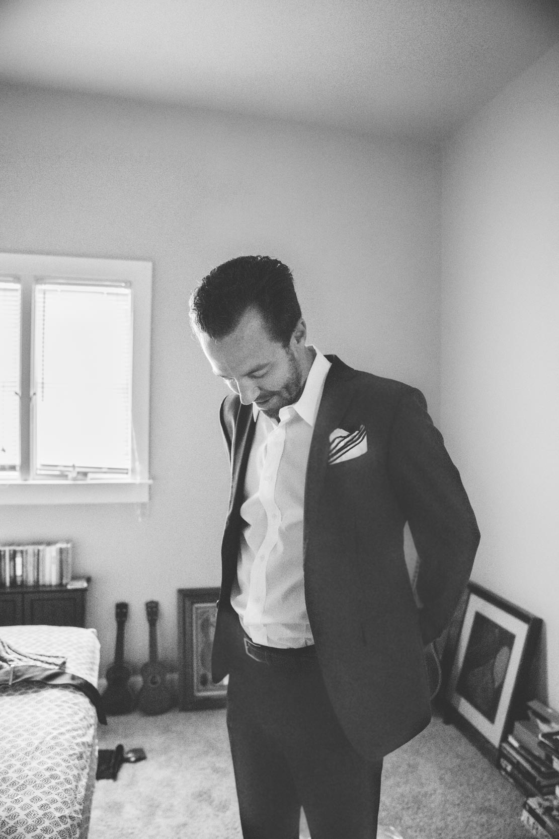 Groom getting dressed on his wedding day