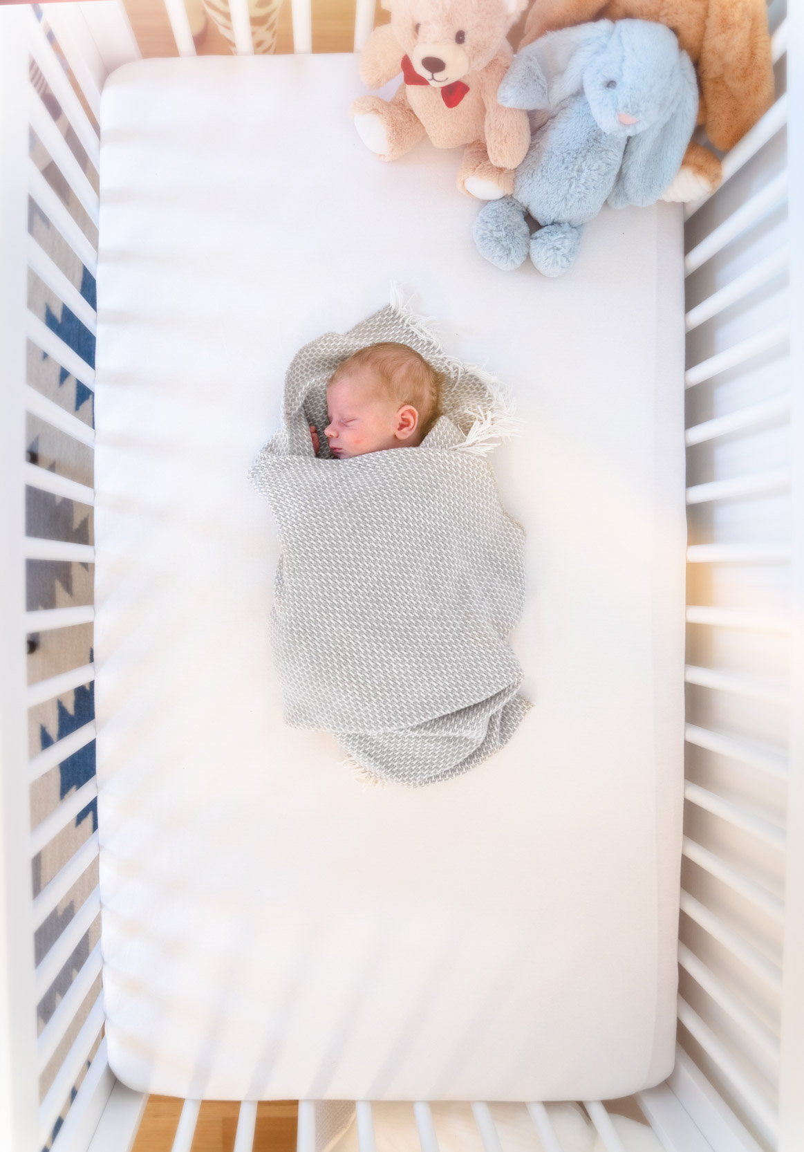 Newborn baby sleeping in baby crib