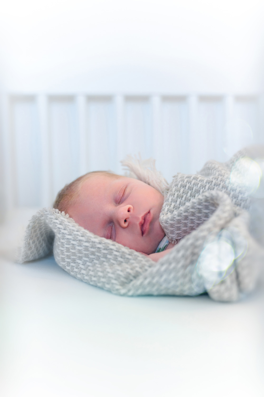 Baby sleeping and dreaming in baby crib