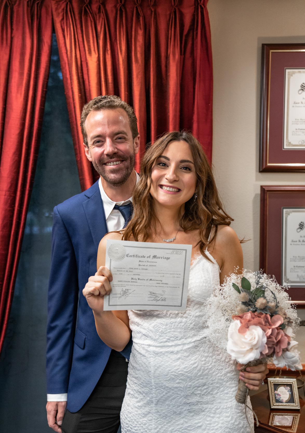 Bride and groom smiling and just married on their wedding day
