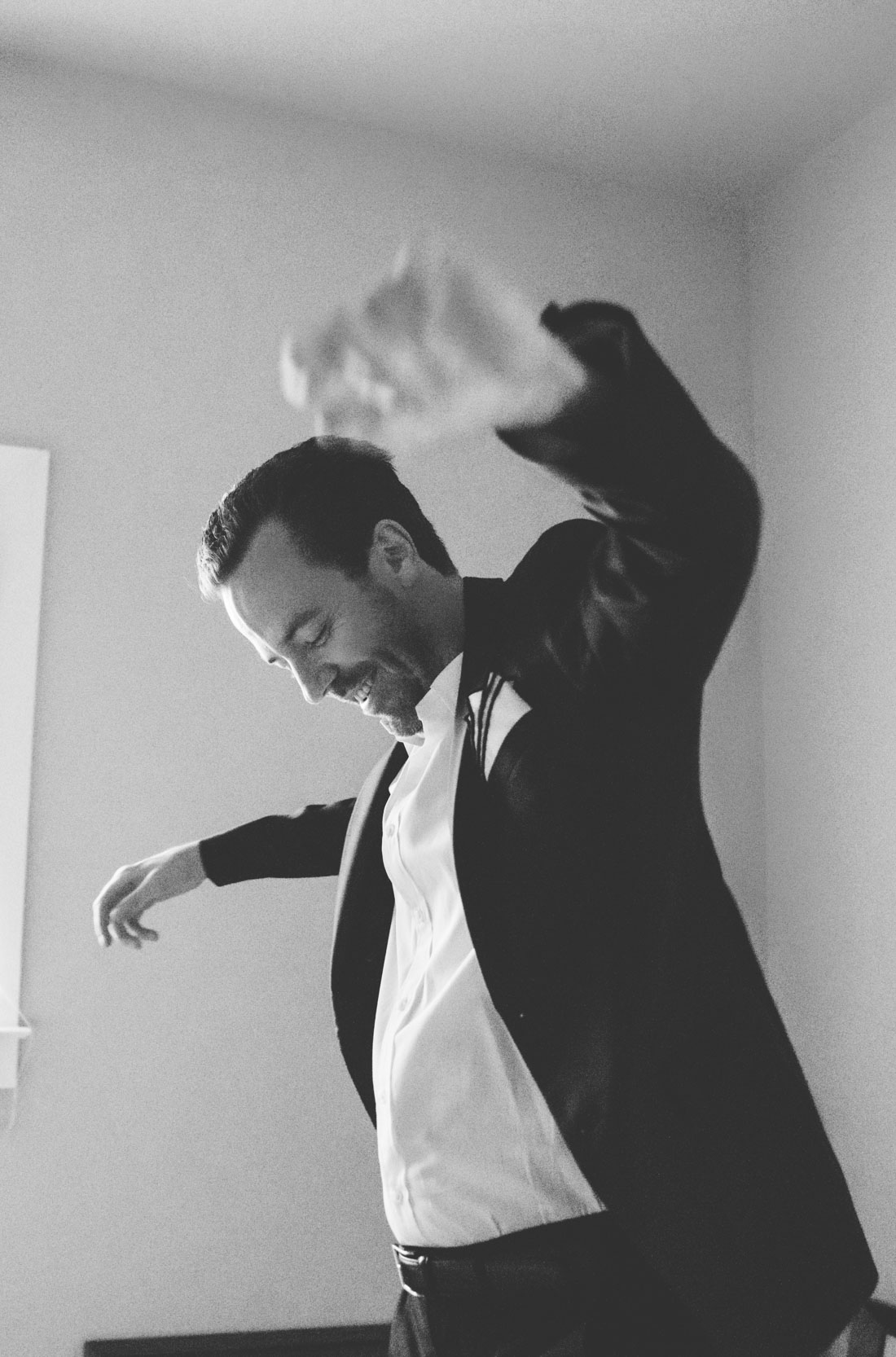 Groom getting dressed on his wedding day