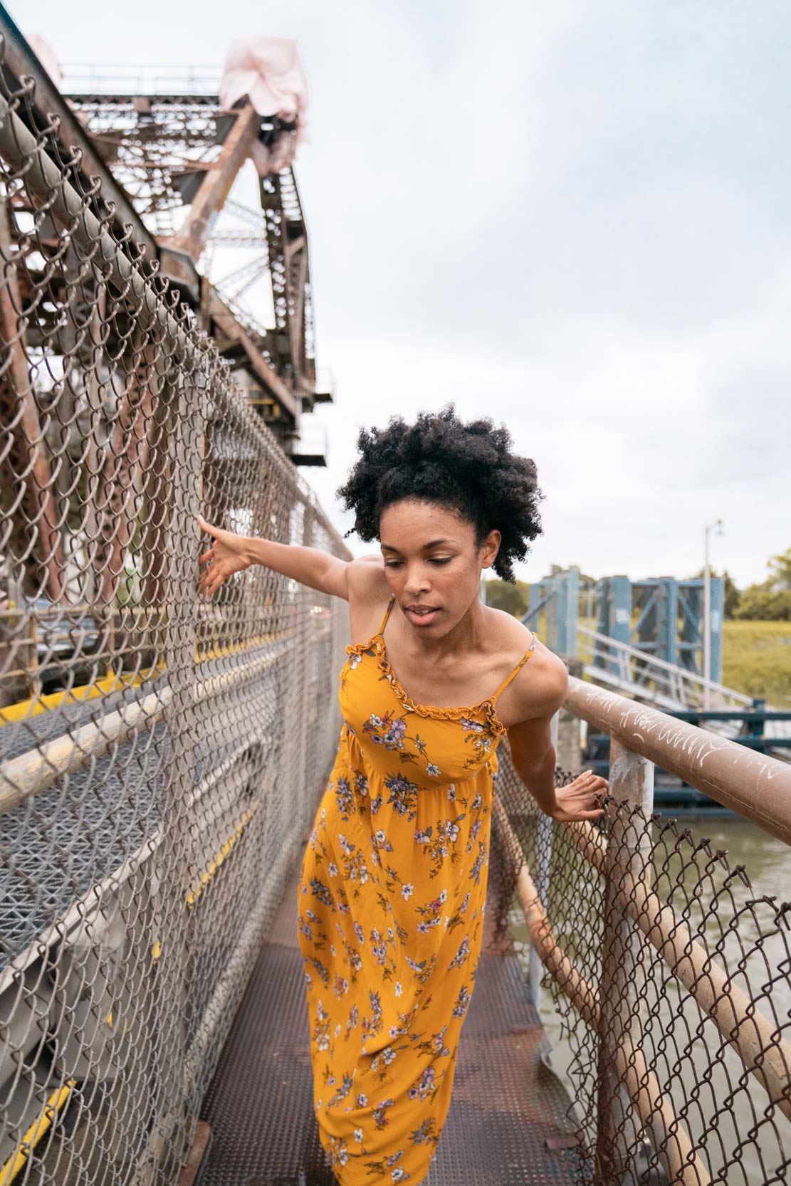 A dancer walking on an abandoned bridge in New Orleans