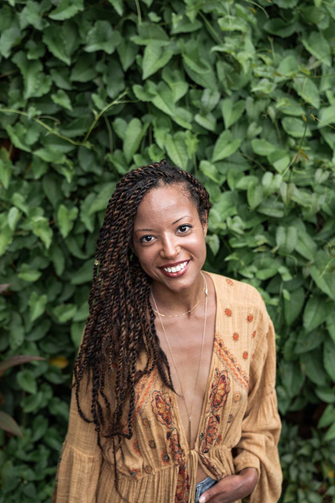 Woman wearing beautiful outfit and smiling in New Orleans French Quarter courtyard
