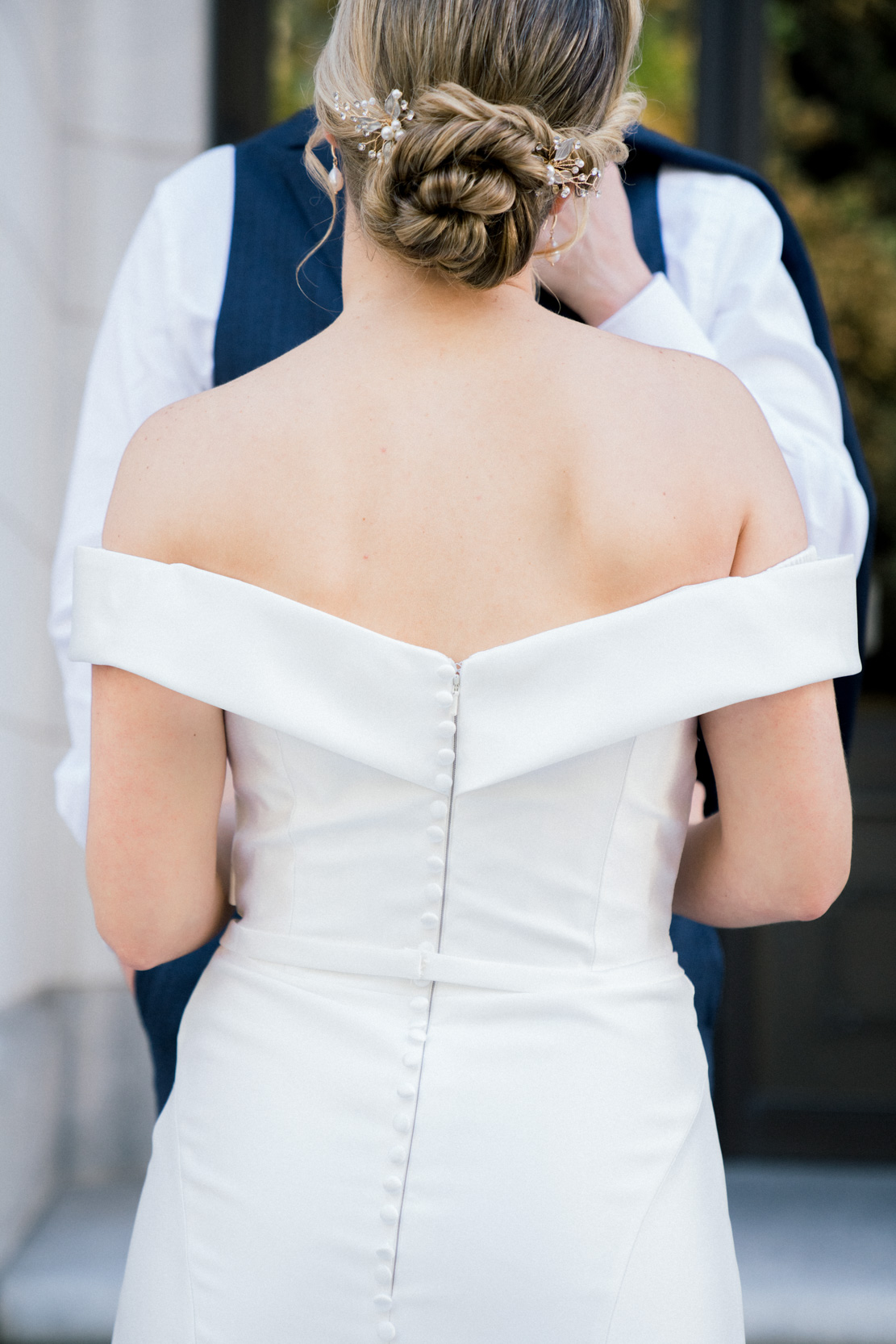 back of wedding gown and bride's hair