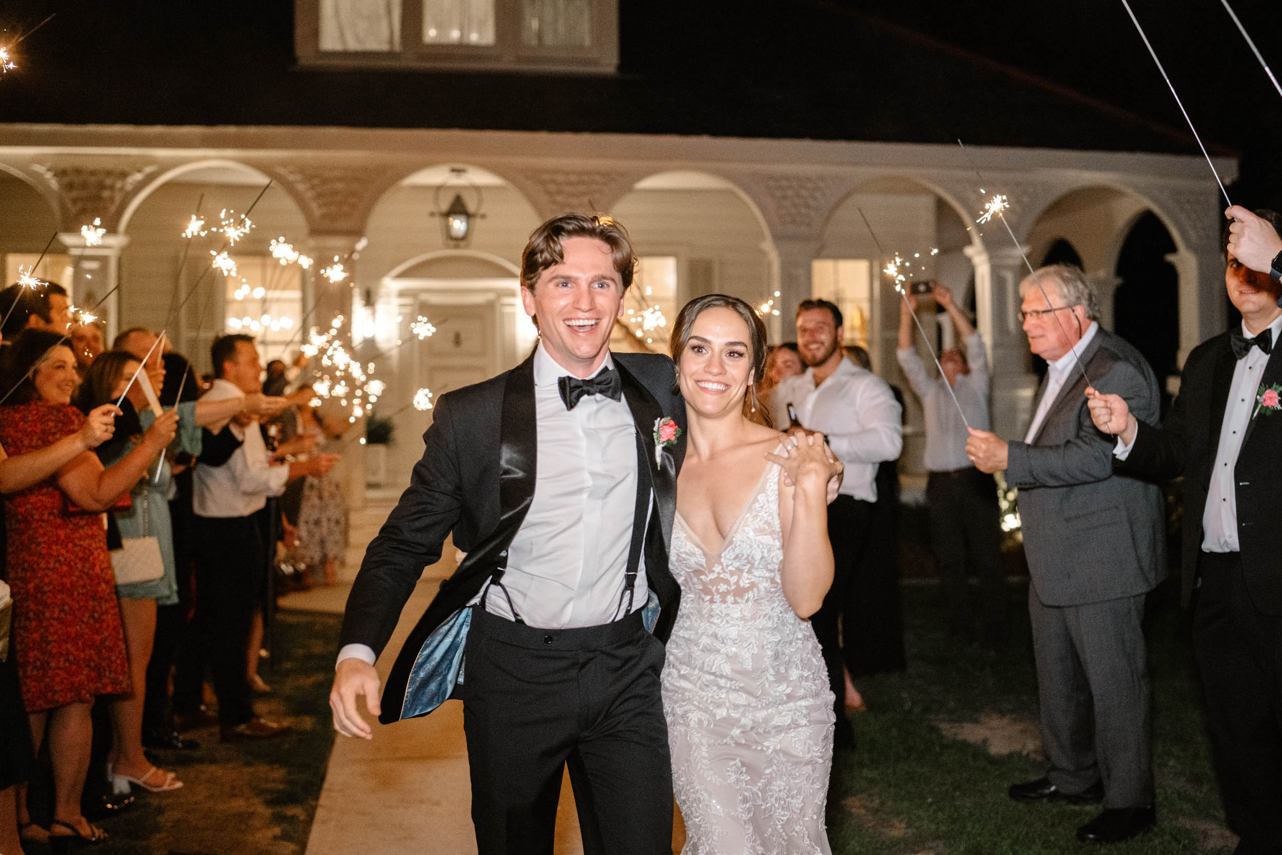 Sparkler exit with bride and groom smiling at Maison Lafitte in Covington, Louisiana