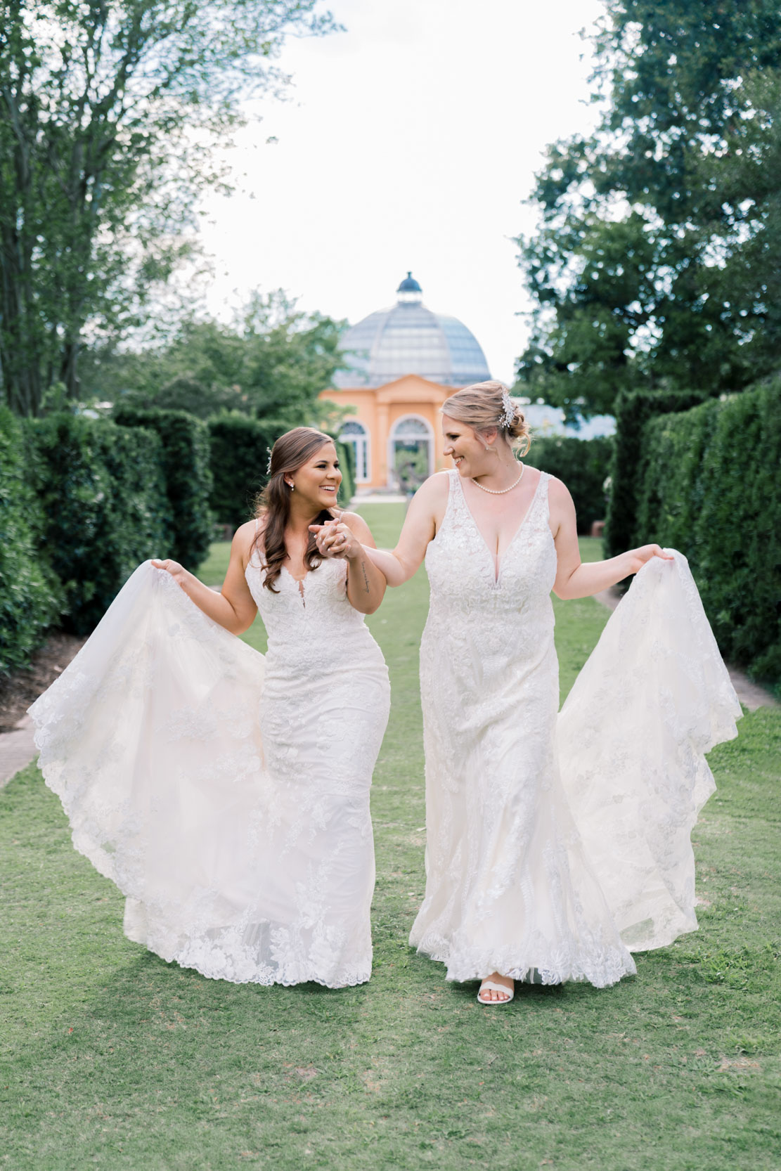 Brides smiling and strolling in City Park Botanical Gardens