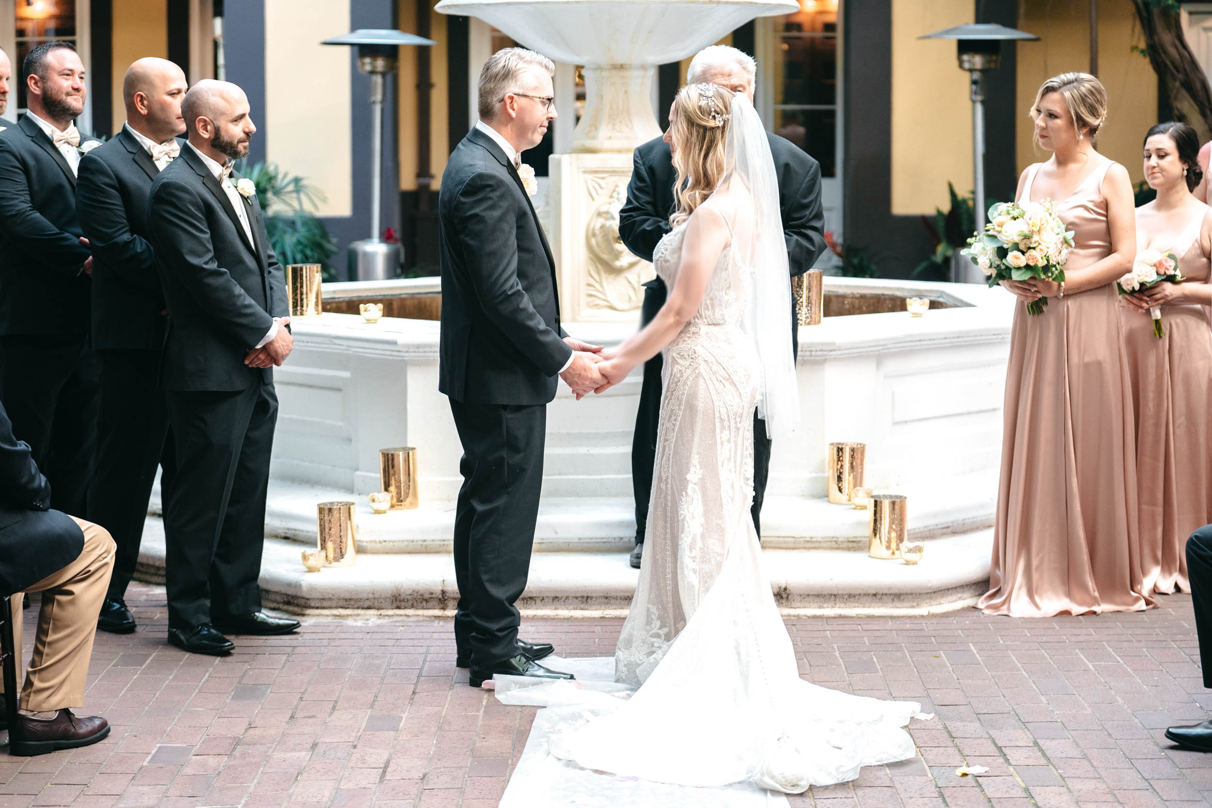 wedding ceremony in courtyard of Hotel Mazarin in The French Quarter of New Orleans