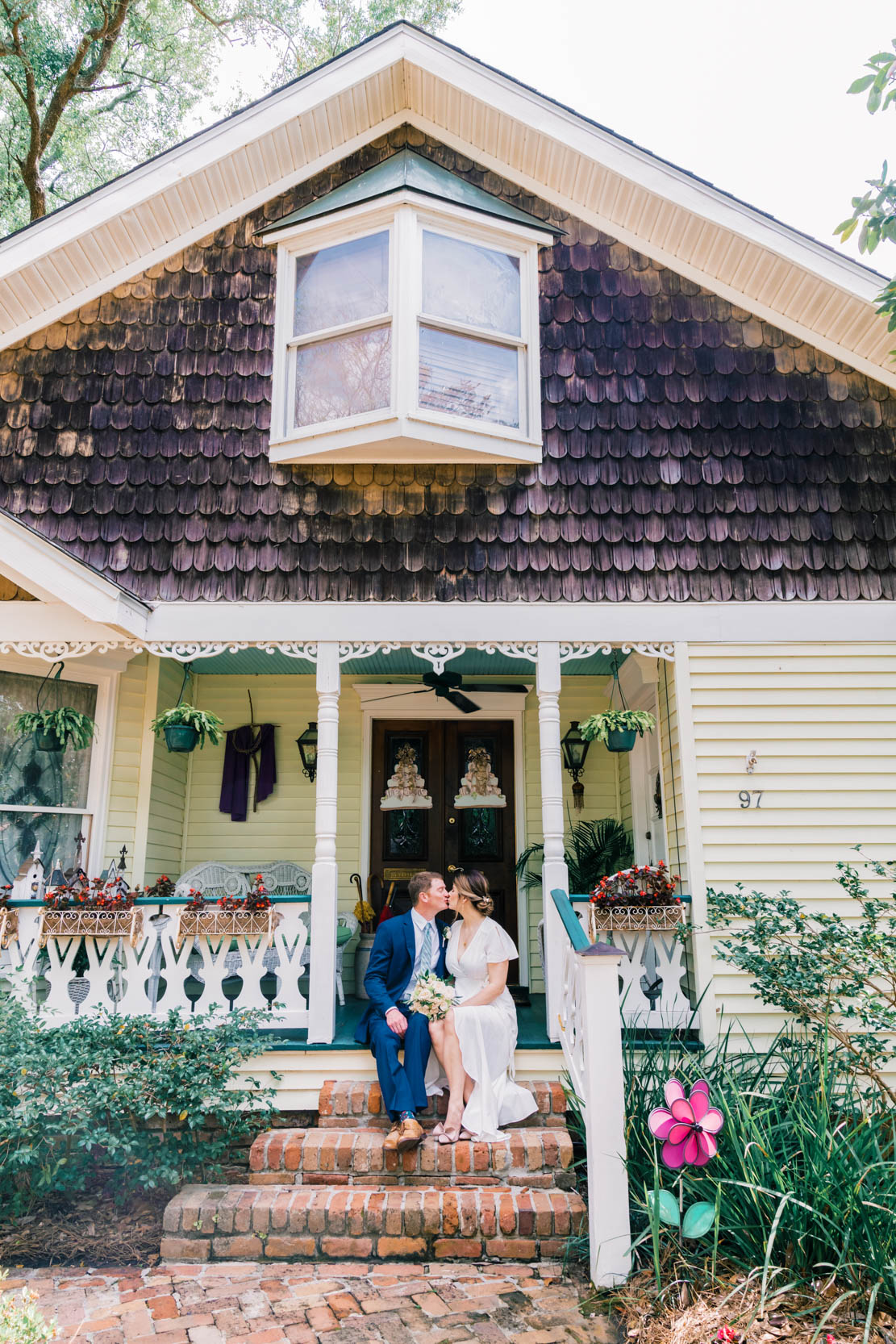 elopement and couple kissing at pretty home in Lake Vista of New Orleans