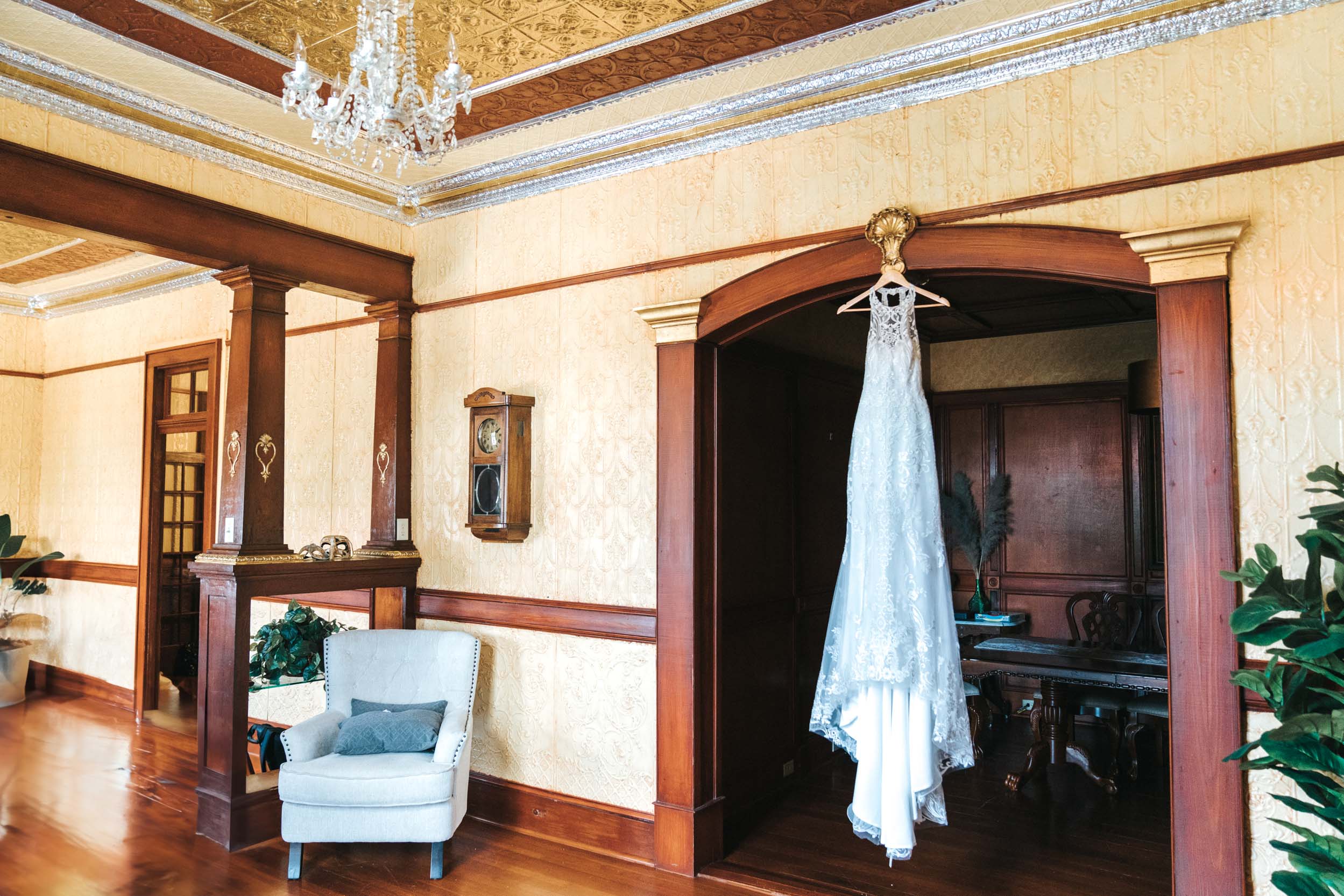 Brides dress hanging in antique home in New Orleans