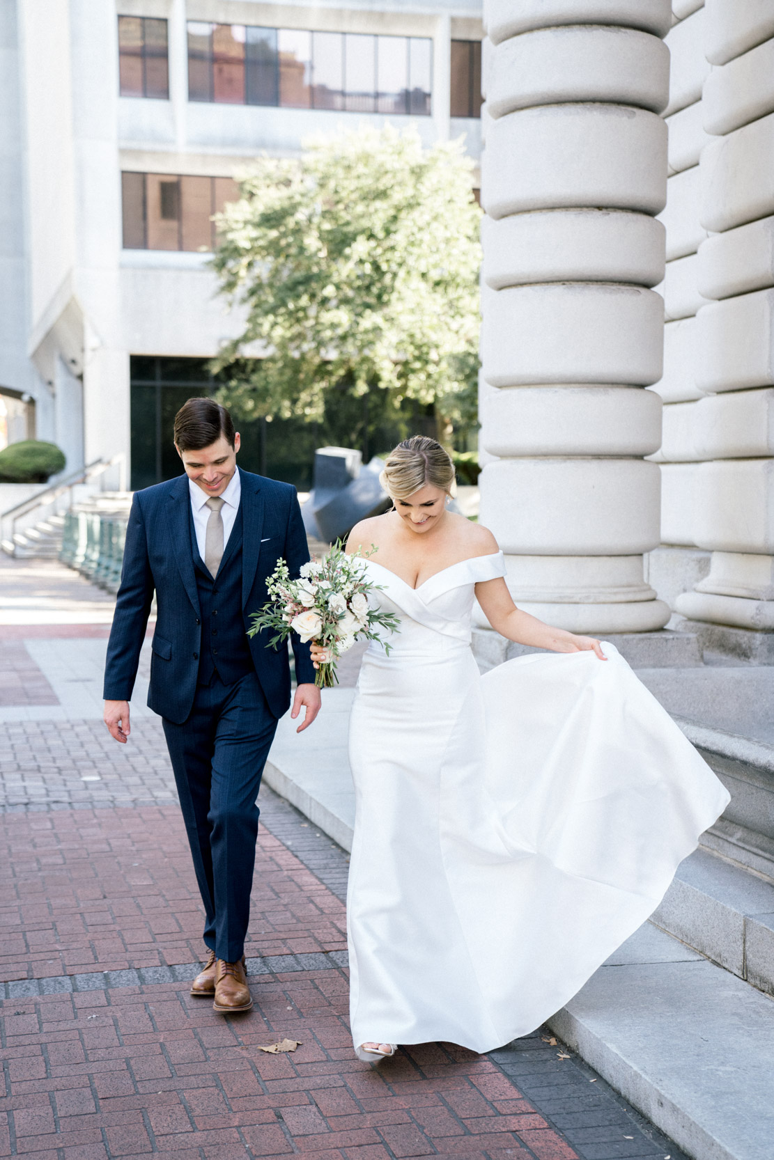 stylish bride and groom walking in French Quarter in New Orleans