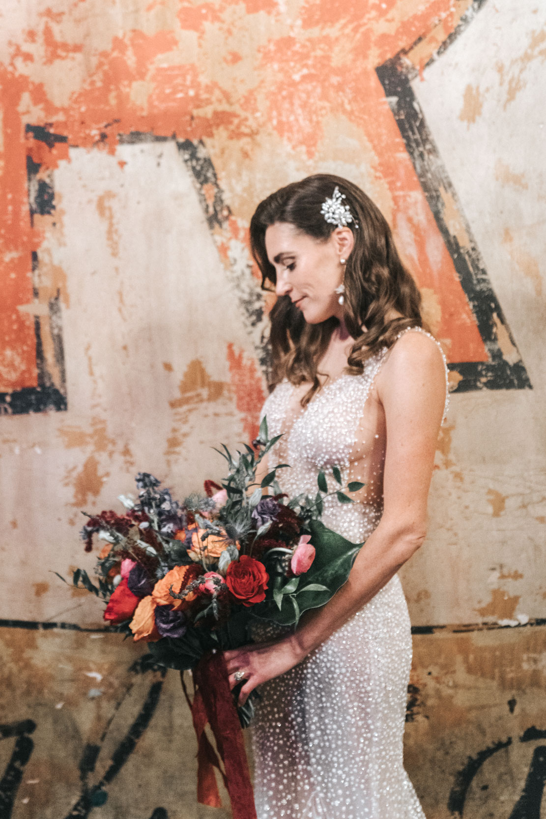 bride looking at her flowers at The Republic venue in New Orleans