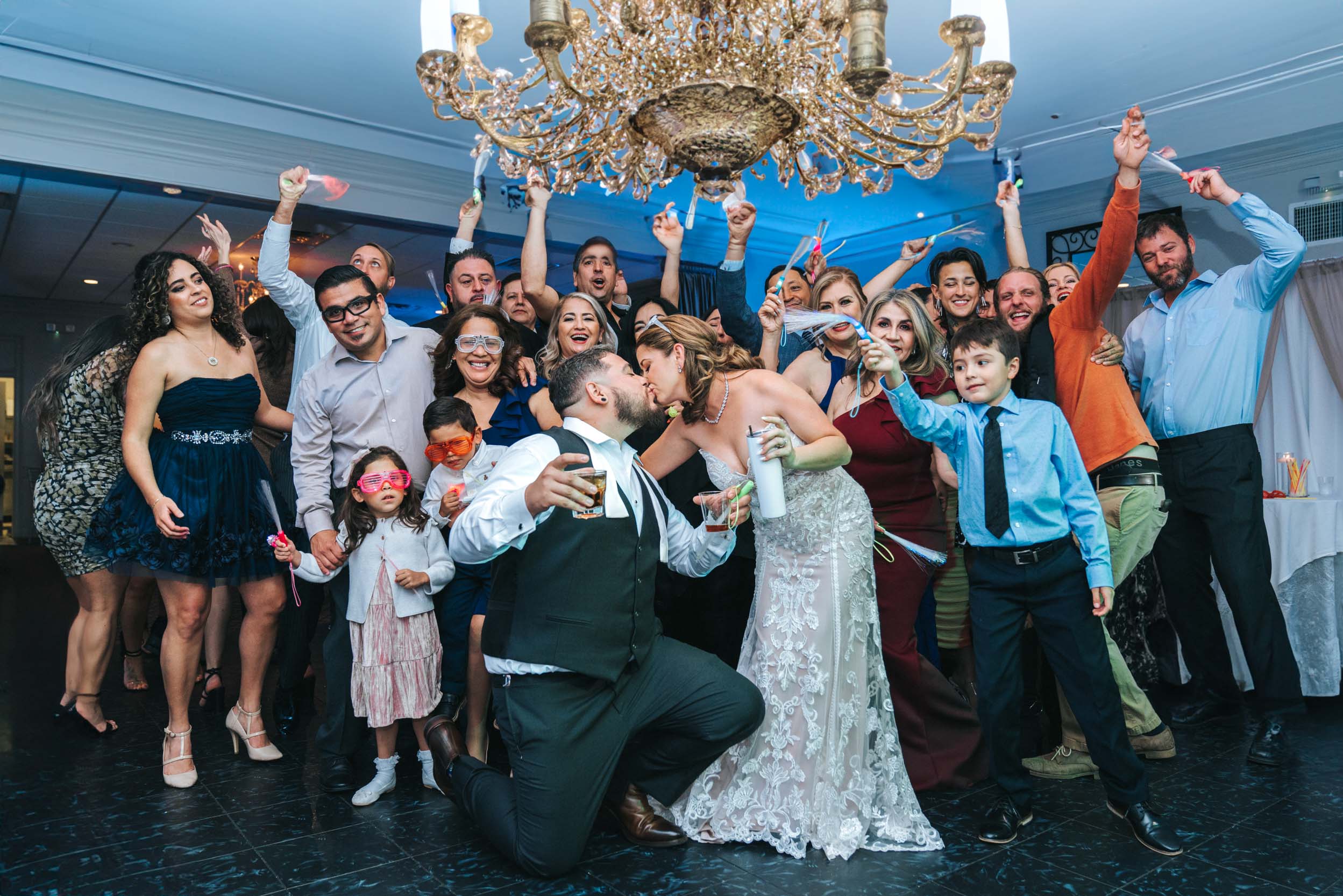 bride, groom and wedding guests celebrating during wedding reception in New Orleans