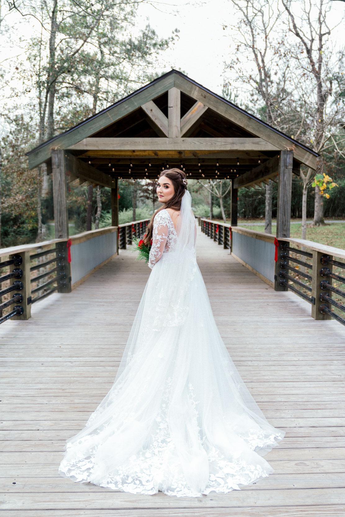 Bride looking back on pier at Creekview Barn in Mississippi