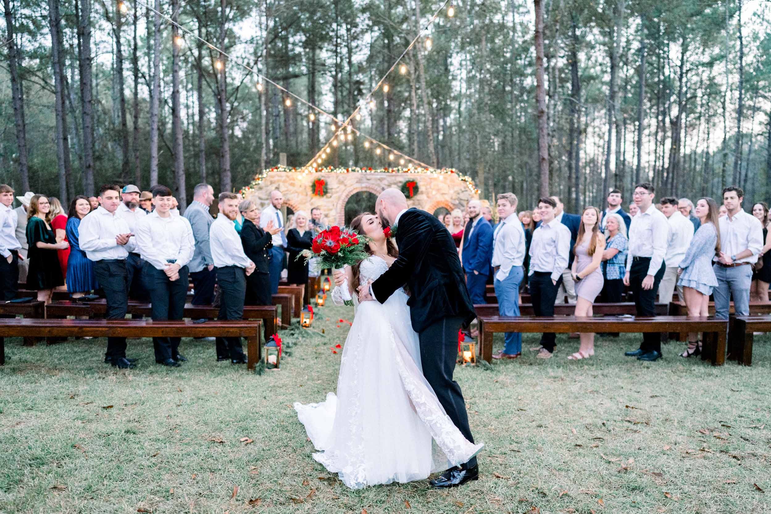 final kissing during wedding ceremony at Creekview Barn in Mississippi