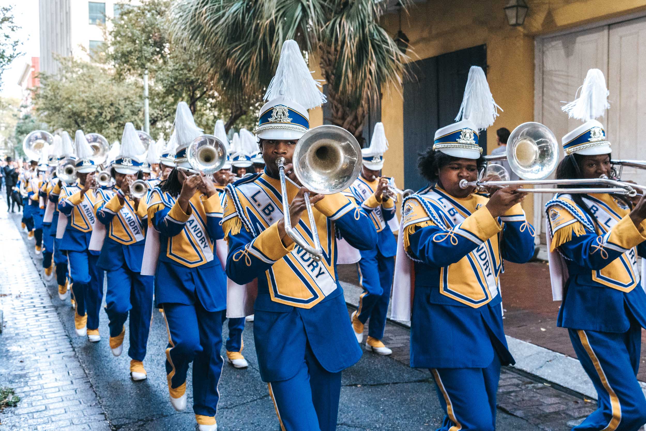 Band marching during wedding parade in French Quarter of New Orleans