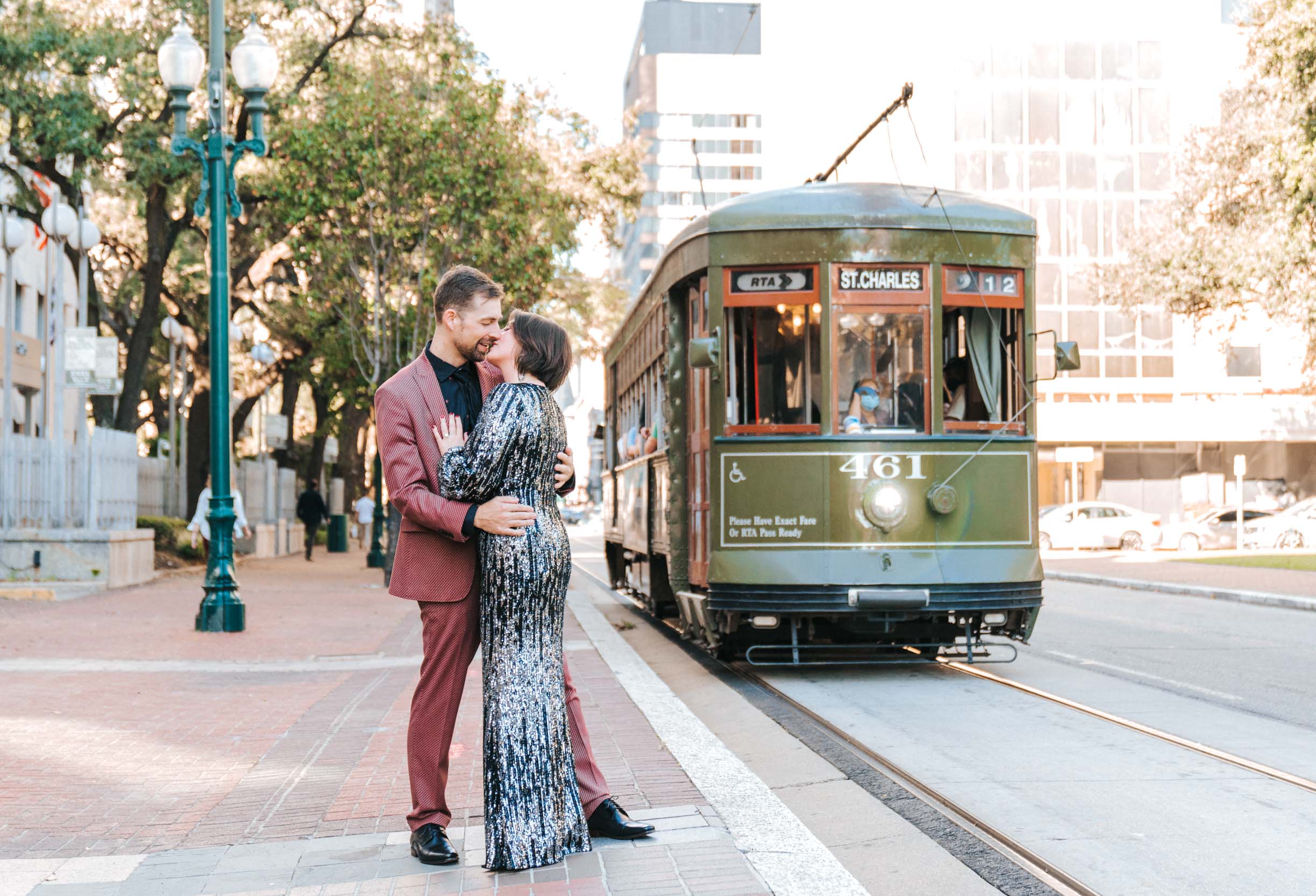 bride and groom getting eloped in front of streetcar trolley in New Orleans