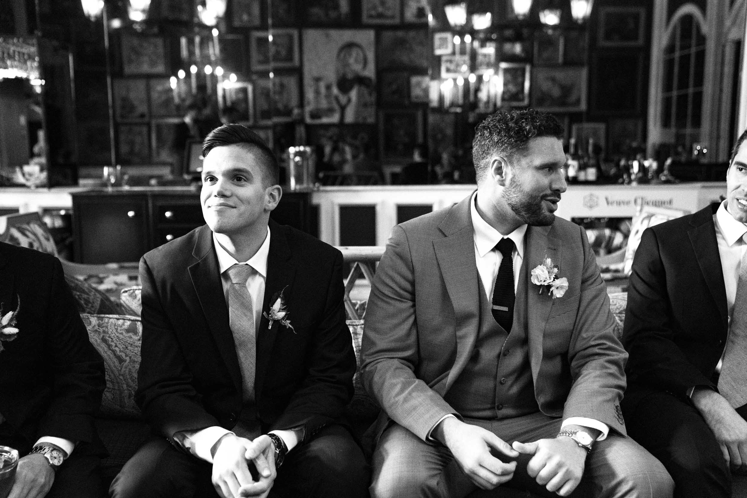 groomsmen sitting in lobby of The Pontchartrain Hotel in New Orleans